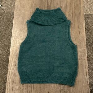 Fuzzy turtle neck sweater vest.